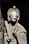 Bangkok Wat Arun - Details of the statues of Chinese saints of the pagoda at the corners of the Ubosot coutyard. 